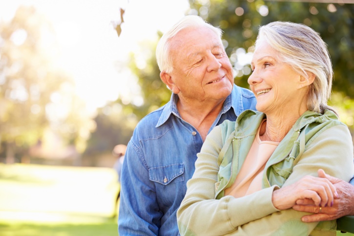 Outdoor Portrait Of Loving Senior Couple